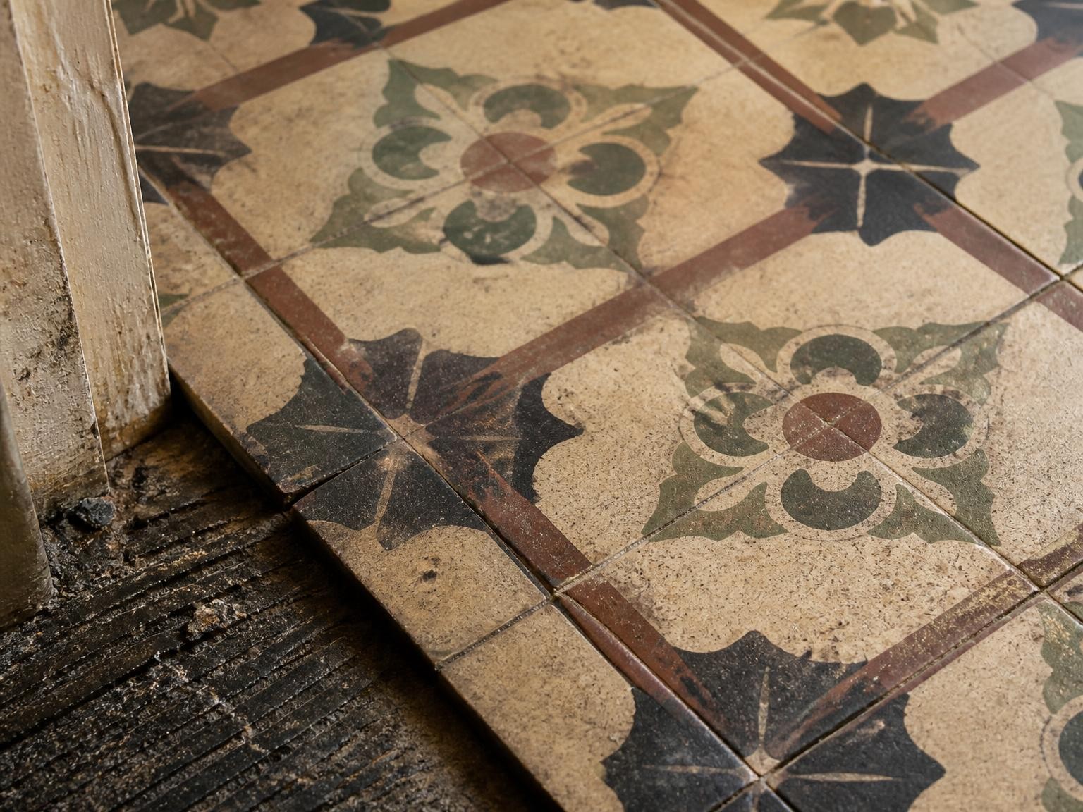 Old floor tiles and adhesive that may require asbestos sampling