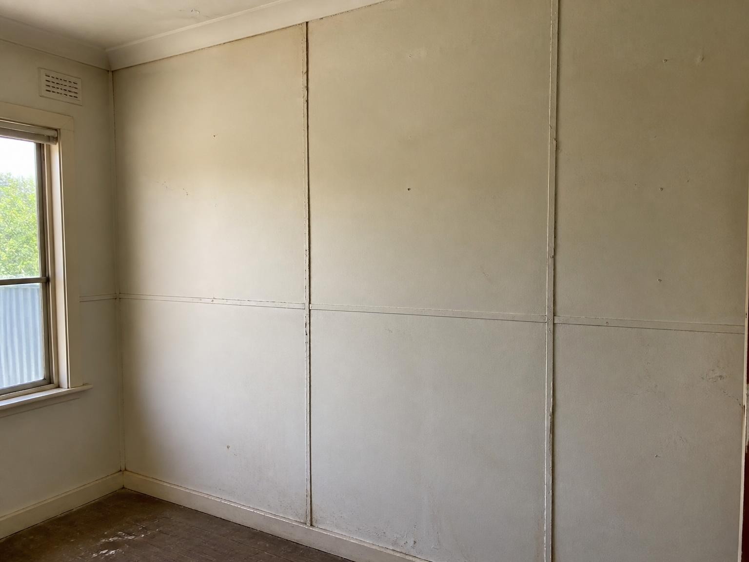 Suspected asbestos wall lining inside an older Australian home