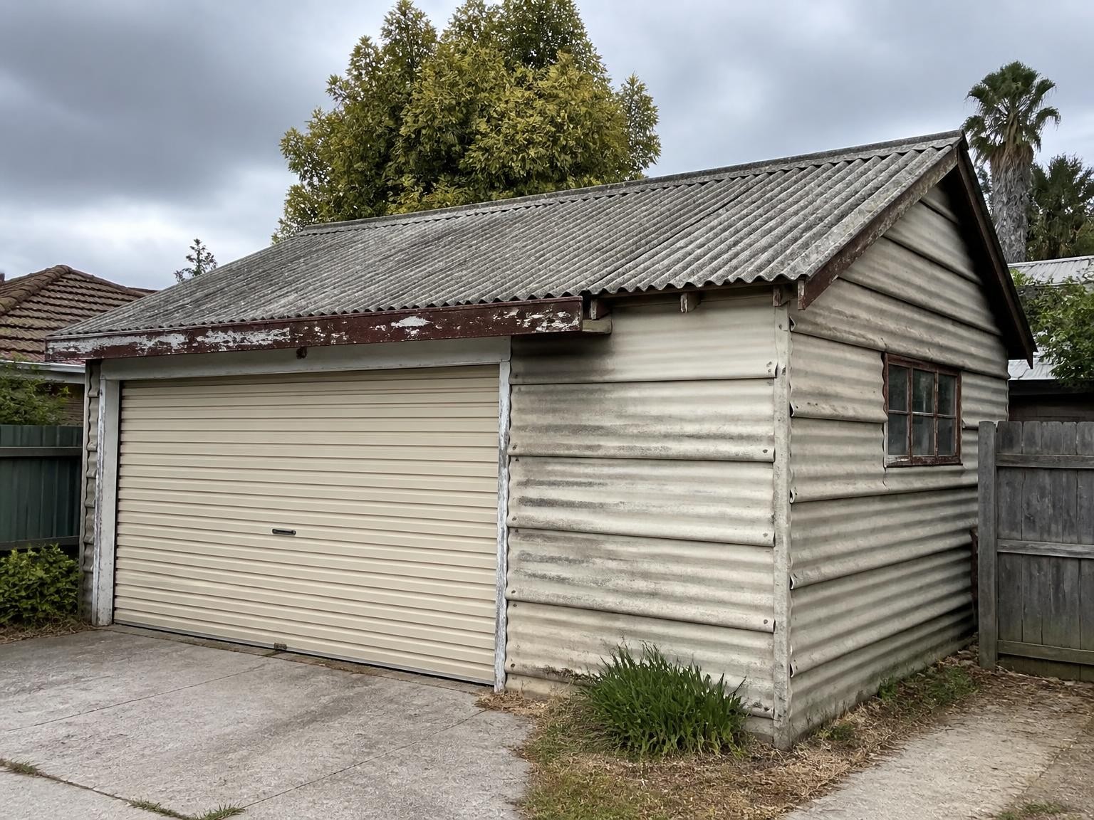 Old garage with suspected asbestos sheeting