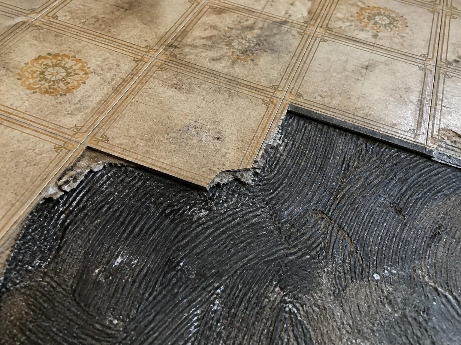 Old floor tiles and adhesive that may contain asbestos